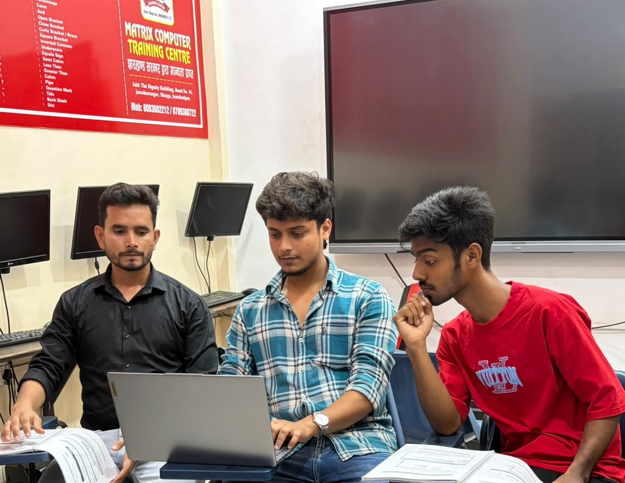 Students using computers during practical training